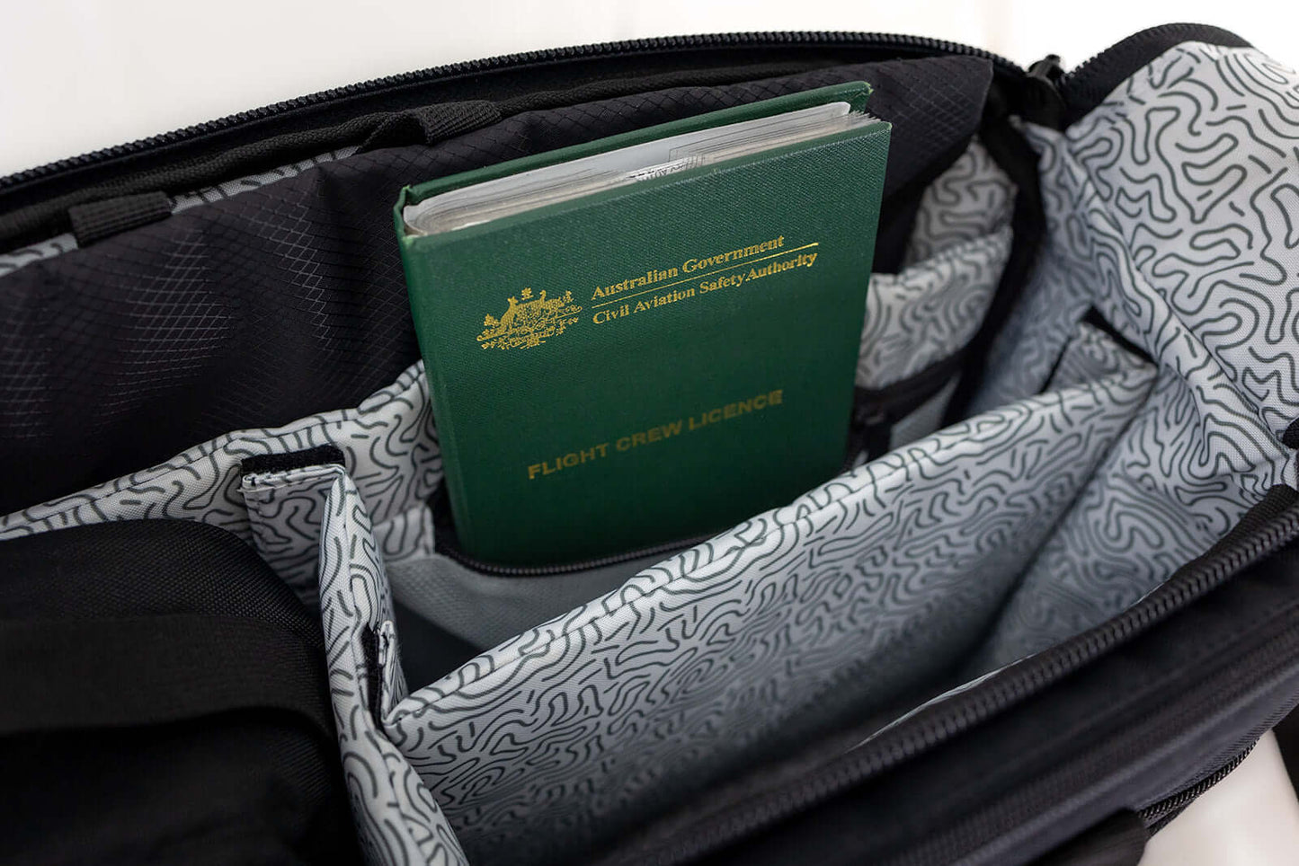 Nav & Co Flight Bag on its side showing licence and passport wallet storage